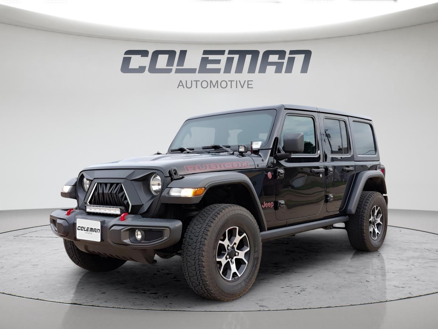 2021 Jeep Wrangler Unlimited Rubicon in Black Clearcoat — front three-quarter view