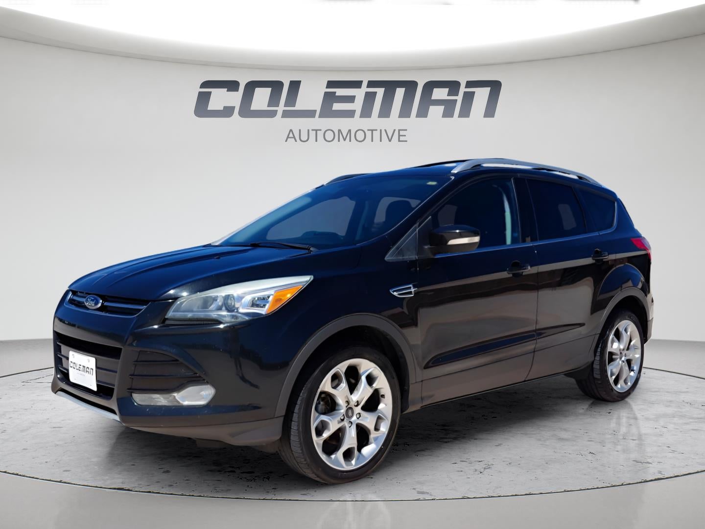 2013 Ford Escape Titanium in Tuxedo Black Metallic — front three-quarter view