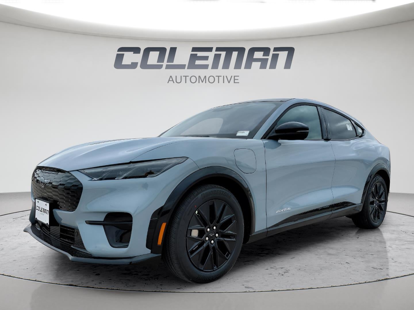 2026 Ford Mustang Mach-E Premium in Glacier Gray Metallic Tri-Coat — front three-quarter view