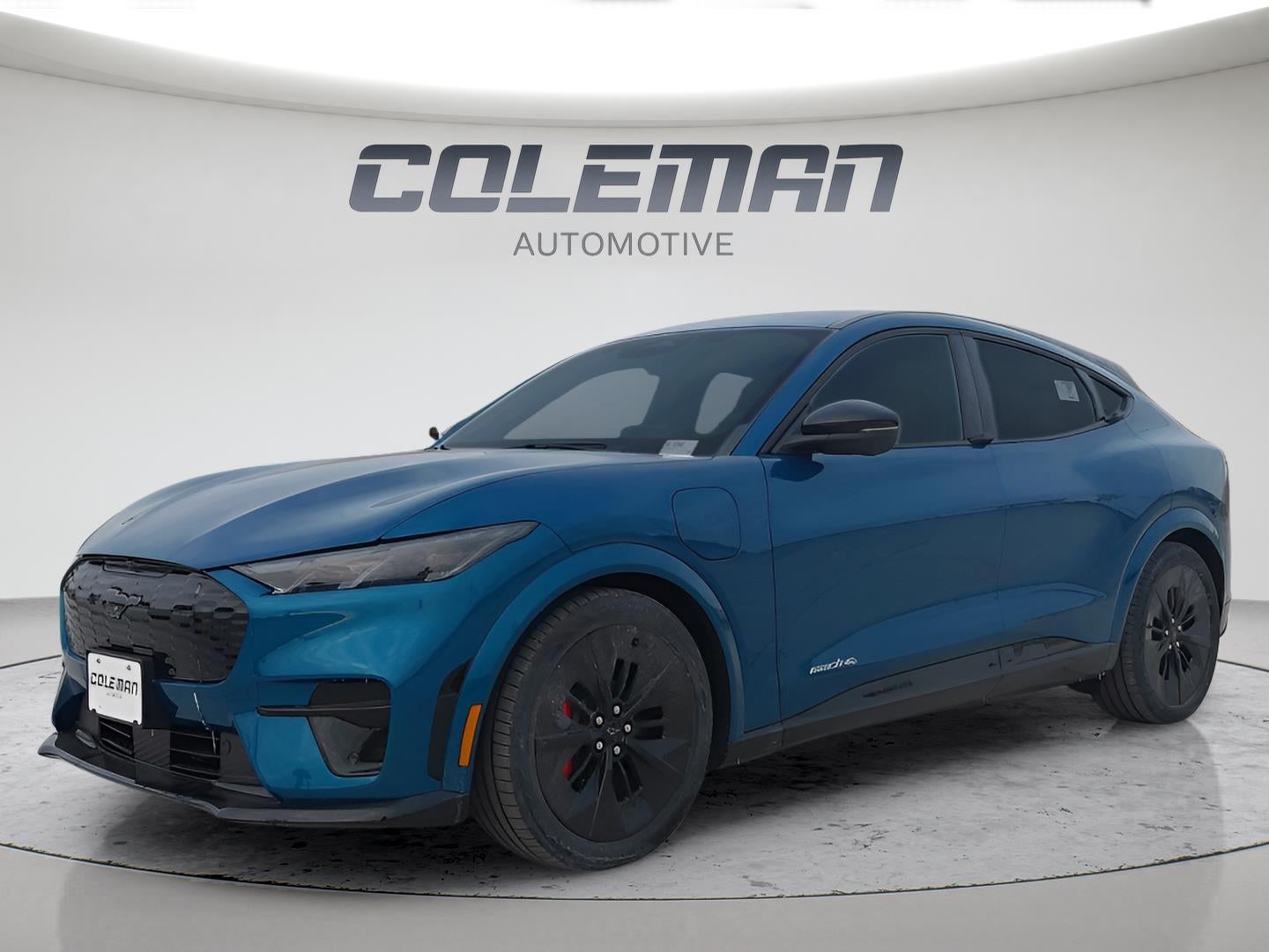 2026 Ford Mustang Mach-E GT in Adriatic Blue — front three-quarter view